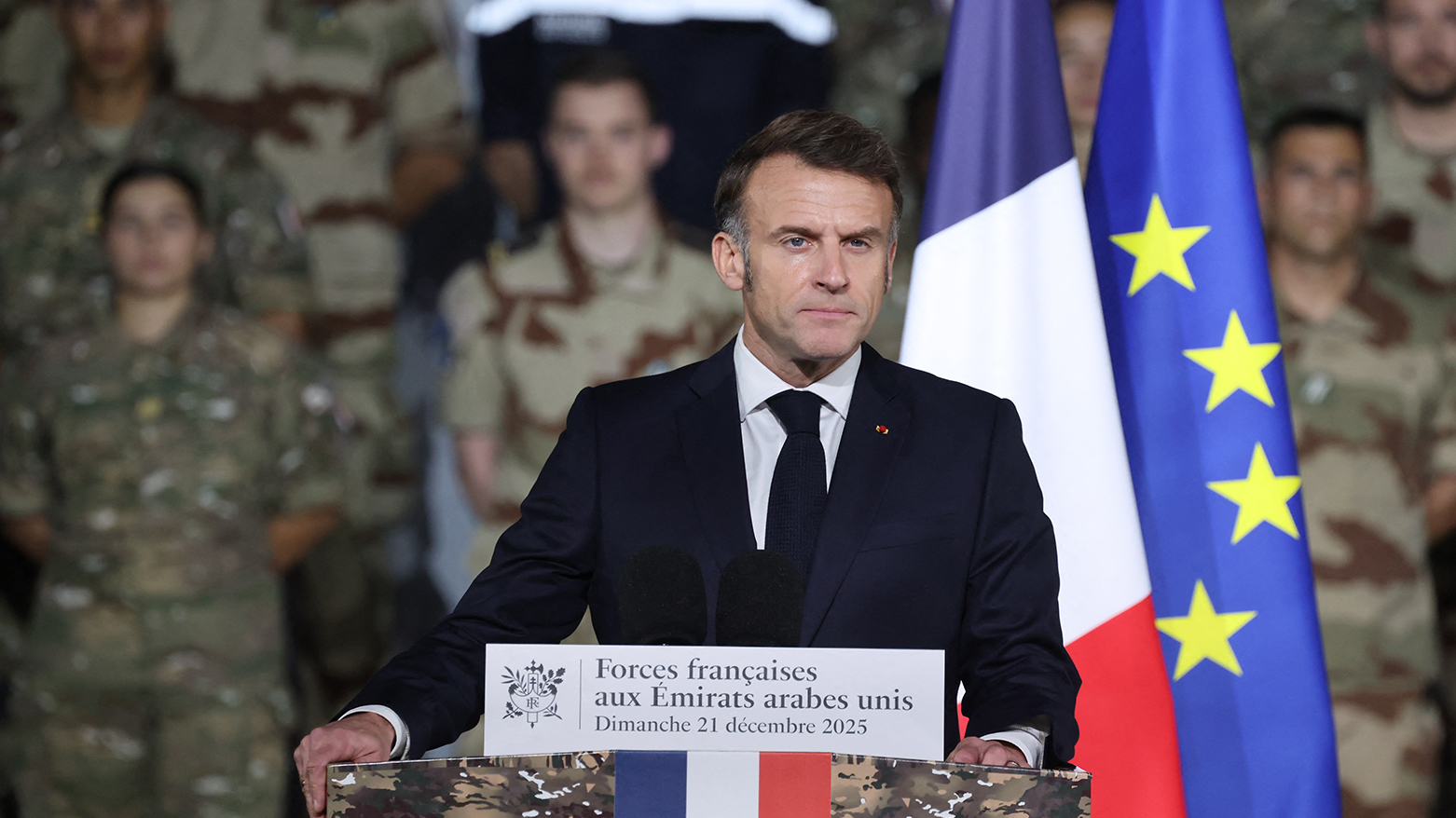 France's President Emmanuel Macron addresses French troops during a ceremony at the 5th Cuirassier Regiment's base in Zayed Military City, near Abu Dhabi, on December 21, 2025.