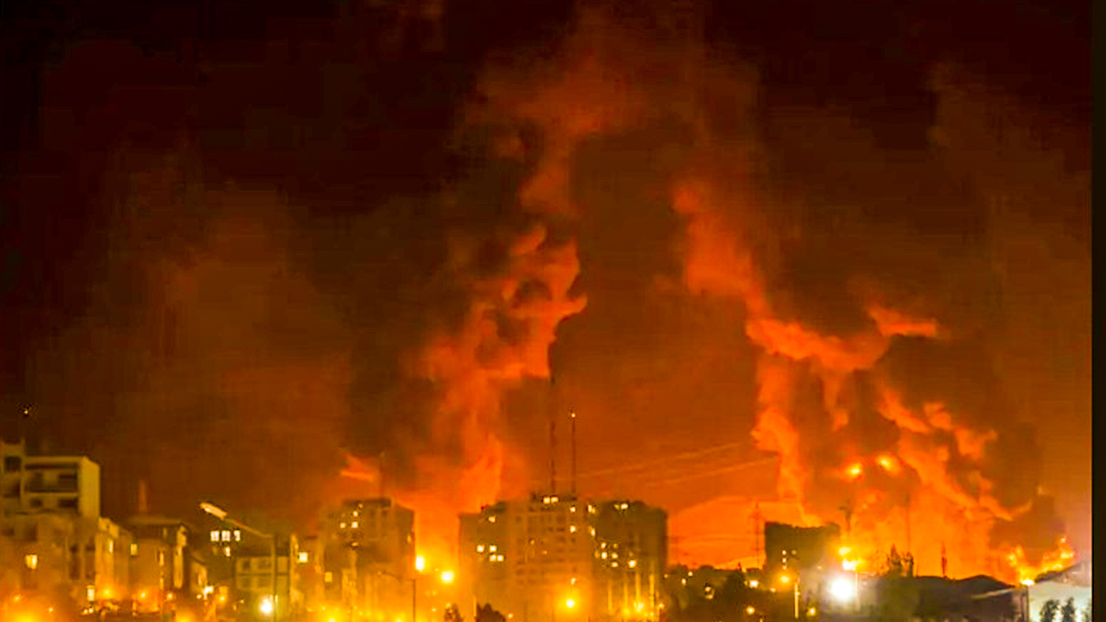 Heavy fire and thick plumes of smoke rise over Tehran following an intensive Israeli night strike targeting infrastructure in the Iranian capital, as explosions illuminated the skyline. (Photo: AFP)