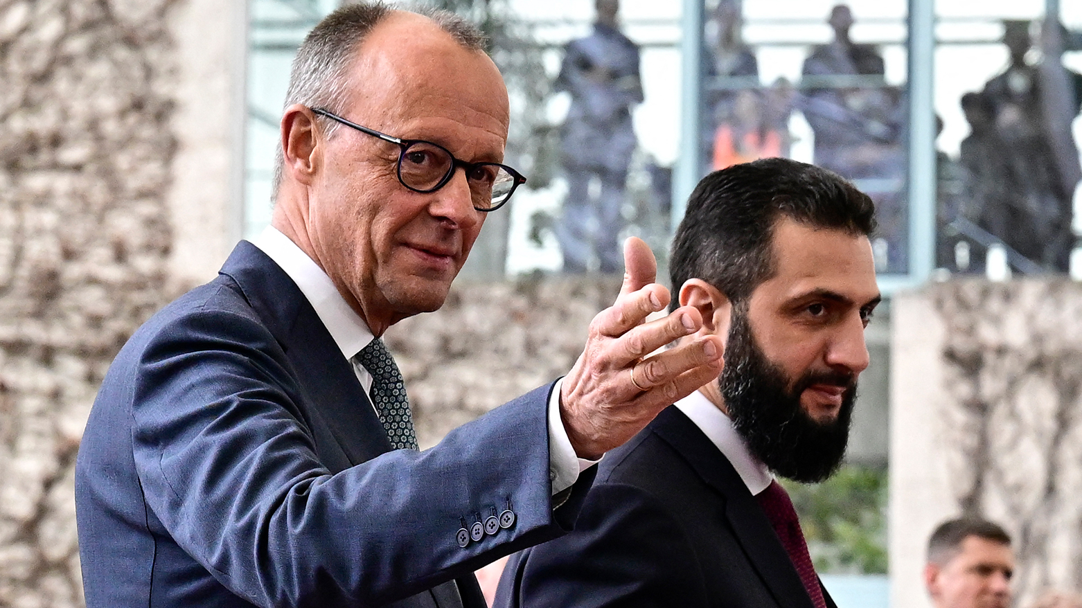 German Chancellor Friedrich Merz (L) welcomes Syrian President Ahmed al-Sharaa at the Chancellery in Berlin on March 30, 2026. (AFP)