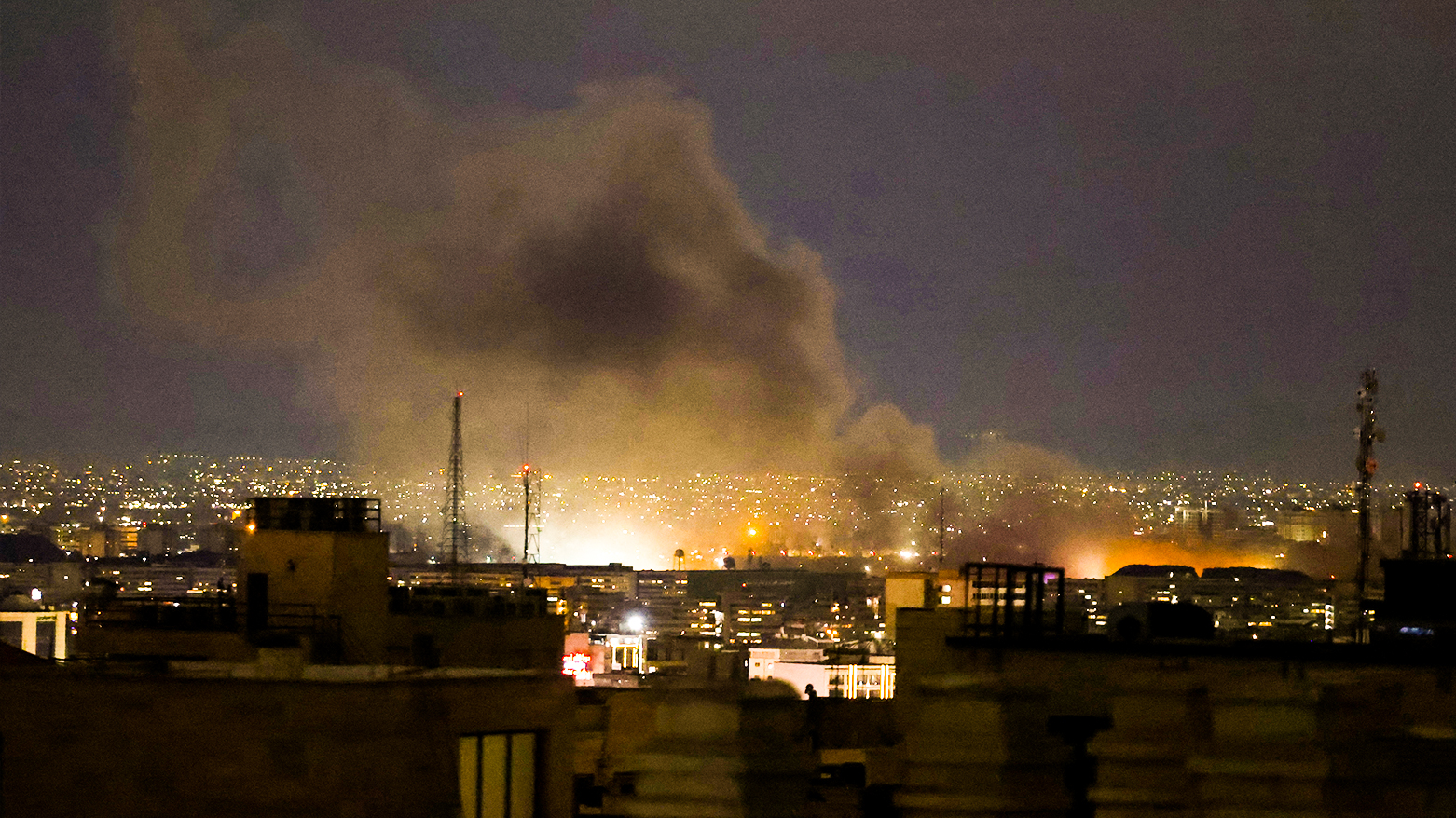 A plume of smoke rises from the site of a strike in Tehran, Iran, late on March 28, 2026. (AFP)