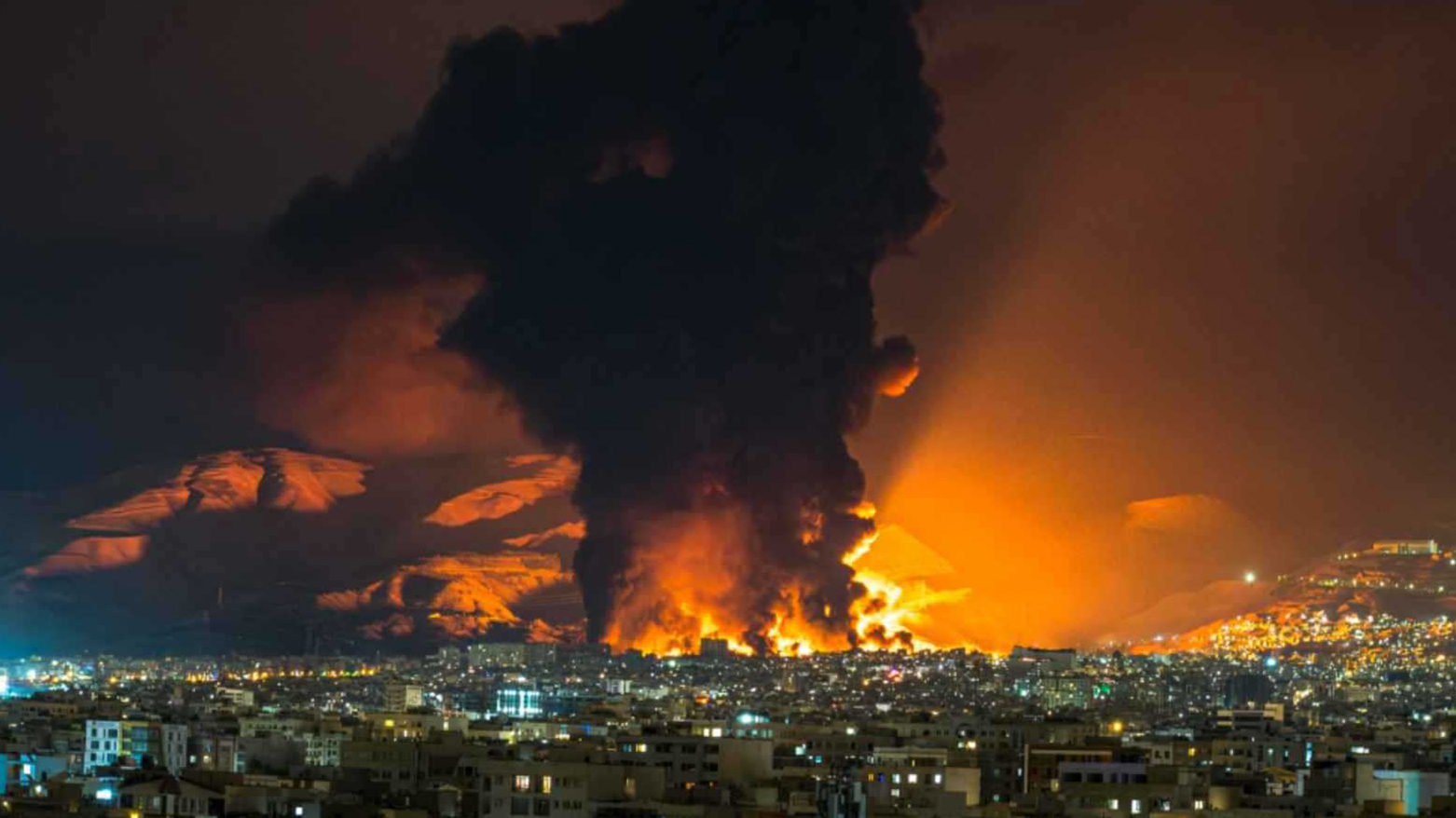 Smoke and flames rise at the site of airstrikes on an oil depot in Tehran on March 7. (Photo: AFP)