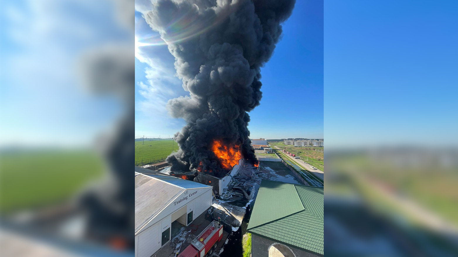 Thick plumes of black smoke and towering flames rise from a motor oil storage site on the outskirts of Erbil following a series of drone attacks, as emergency crews battle to contain the blaze, April 1, 2026. (Kurdistan24)