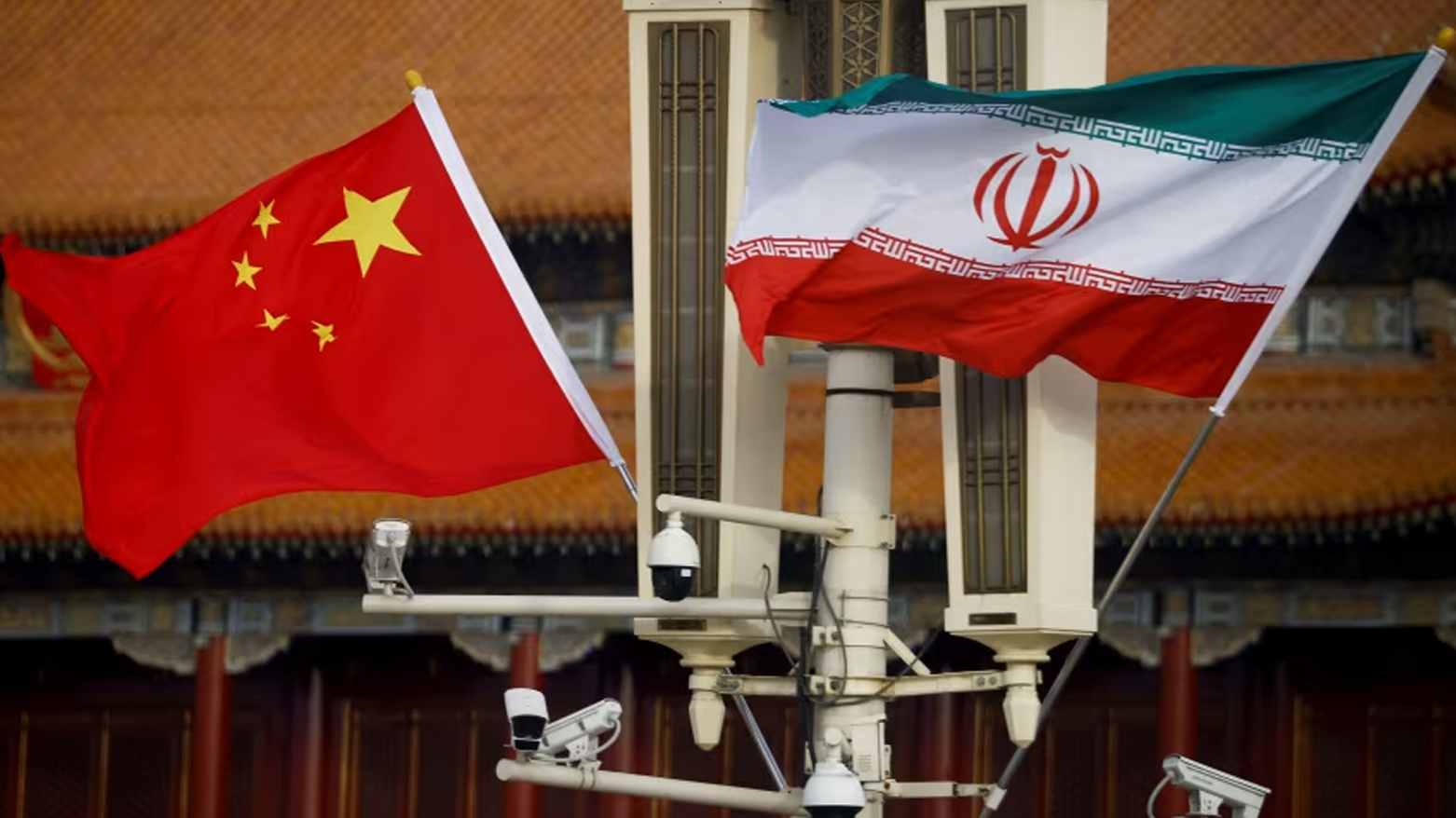 The national flags of China and Iran fly in Beijing's Tiananmen Square on February 14, 2023. (Photo: CNN)