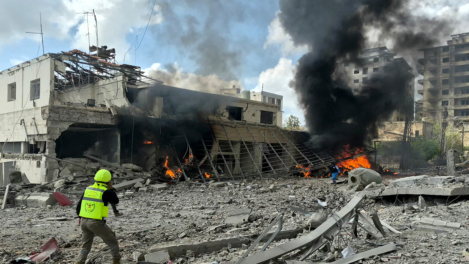 First responders rush to the site of an Israeli airstrike that targeted the Lebanese State Security Center, in the Southern Lebanese city of Nabatieh on Apr. 10 2026. (AFP)