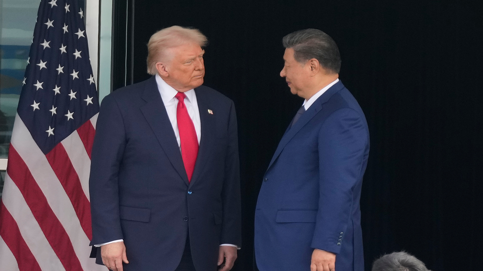 President Donald Trump, L, and Chinese President Xi Jinping, look at each other after their summit meeting at Gimhae International Airport, South Korea, Oct. 30, 2025. (AP)