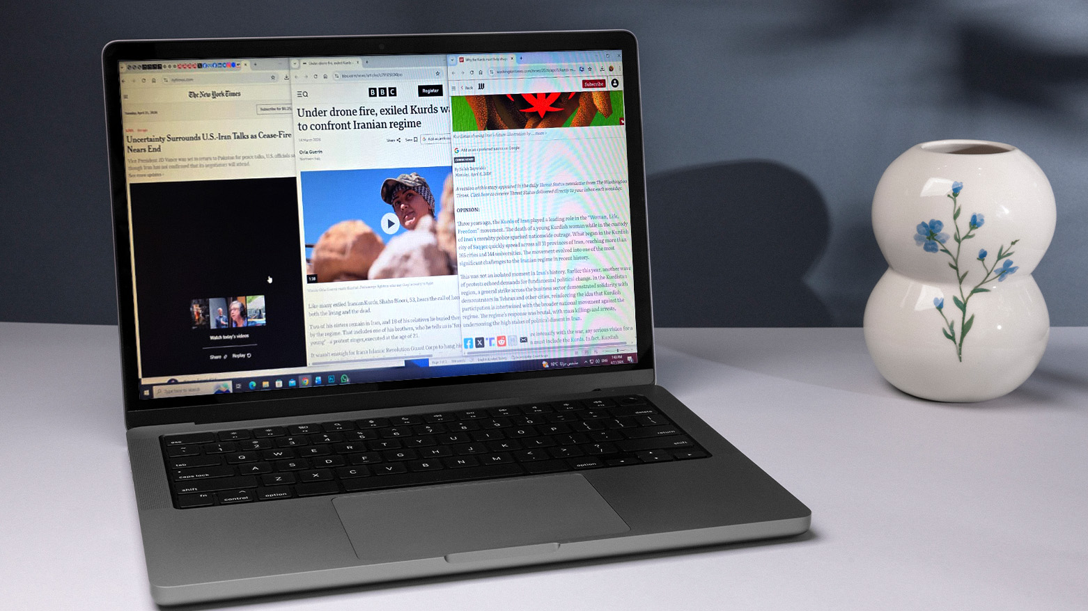 The image shows a laptop screen with several news website tabs open. (Graphic: Kurdistan24)