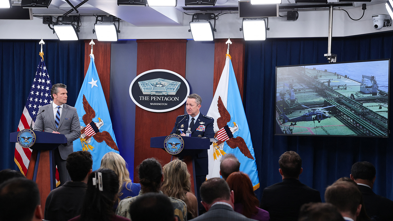 U.S. SoW Pete Hegseth (L) looks on as Chairman of the Joint Chiefs of Staff Gen. Dan Caine speaks during a press briefing at the Pentagon on April 24, 2026. (AFP)