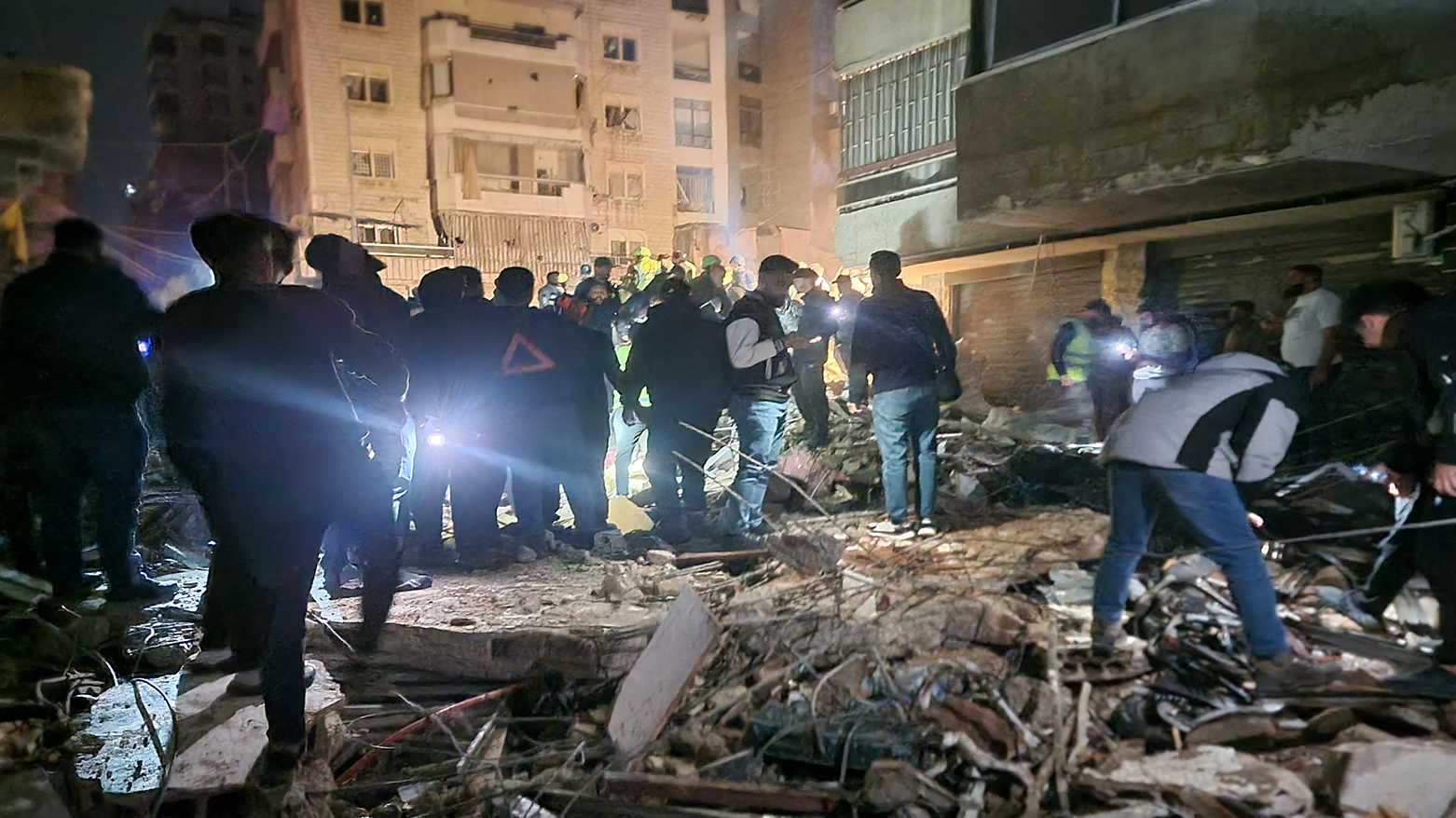 People gather at the site of an Israeli airstrike that targeted Beirut’s southern suburbs neighborhood of Haret Hreik on May 6, 2026. (AP)