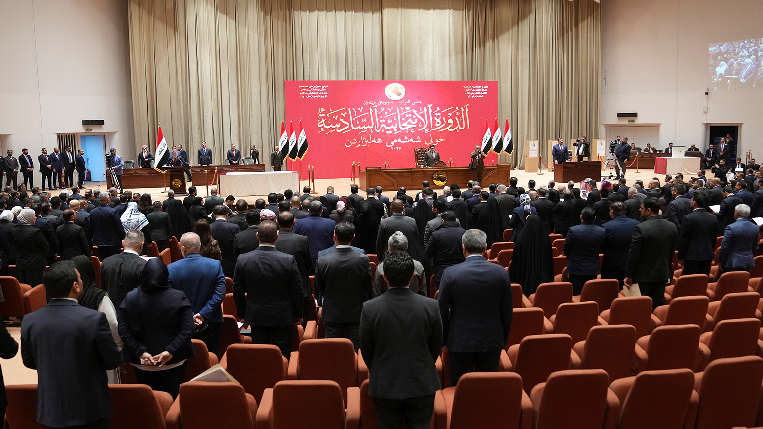 Newly elected lawmakers attend the first parliament session, in Baghdad, Iraq, Dec. 29, 2025. (Iraqi Parliament Media Office via AP)