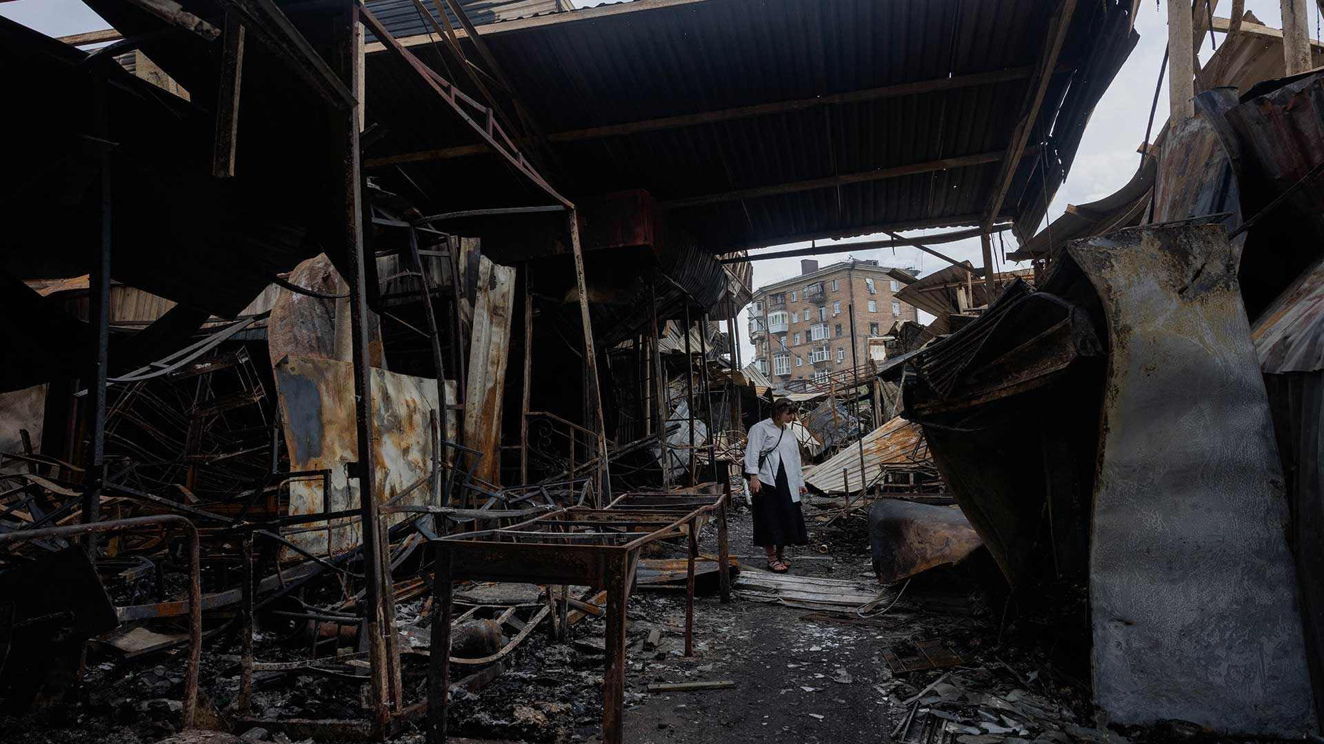 A local resident walks by a damaged shopping center following Russian strikes in Kyiv on May 25, 2026, amid the Russian invasion of Ukraine. (Photo: AFP)