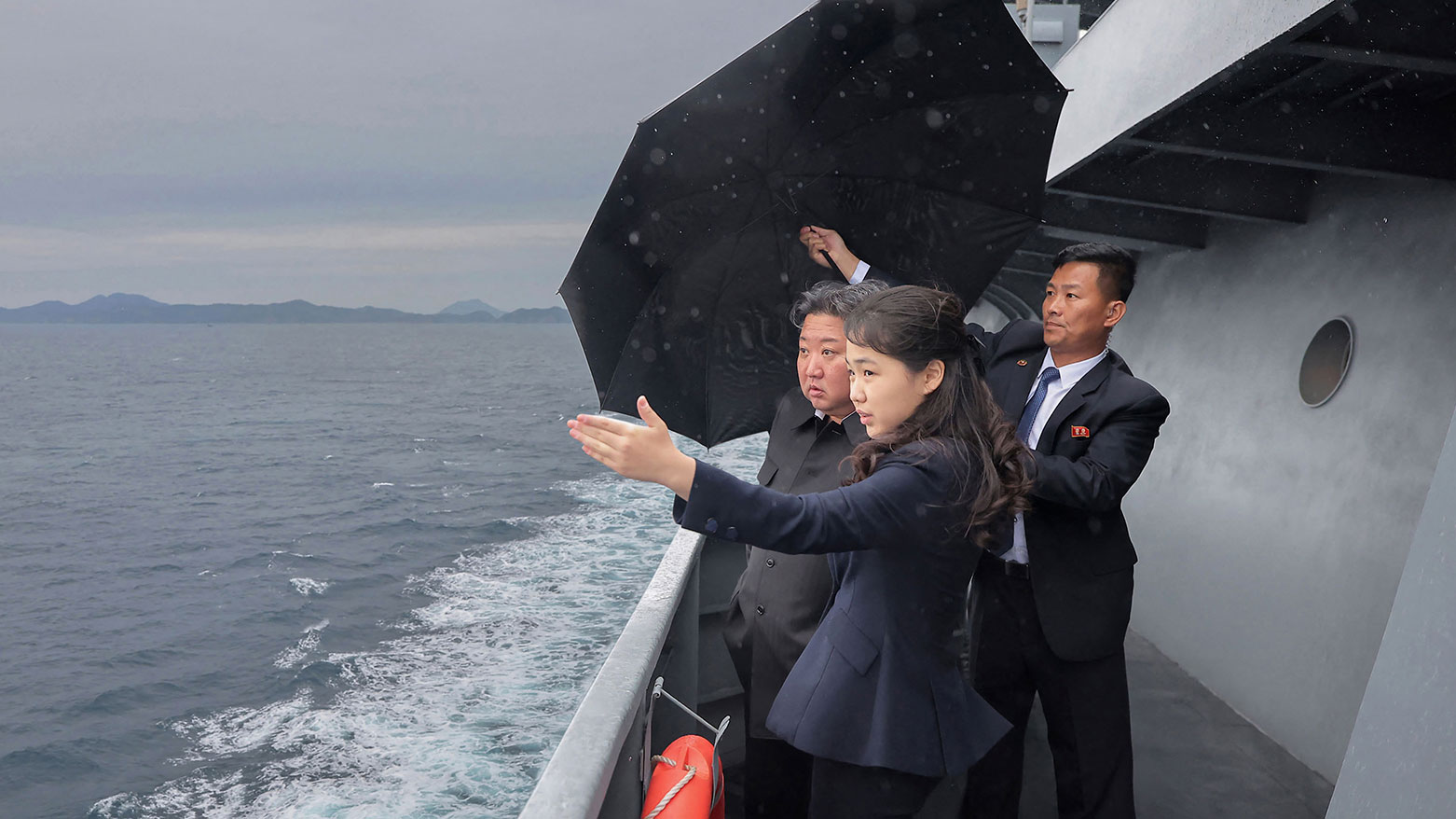 North Korean leader Kim Jong Un, and his daughter Kim Ju Ae observing the sea trials of the "Kang Kyon". (AFP)