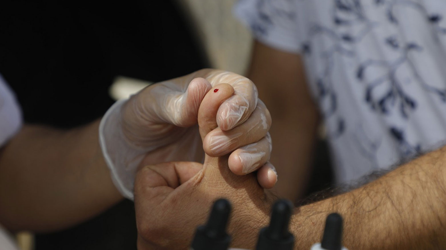 A health staff taking a primary sample before a blood donation, Erbil, June 14, 2021. (Photo: Shafaq News)