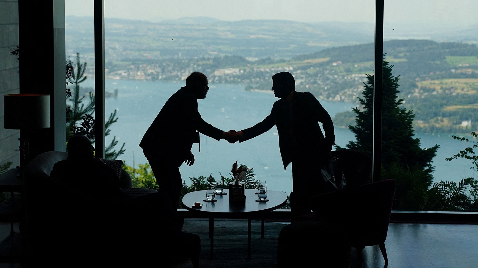 Delegation staff members meet in the lobby on the day of a quadrilateral meeting between the United States, Iran, Pakistan and Qatar at the Burgenstock luxury hotel, Switzerland, on June 21, 2026. (AFP)