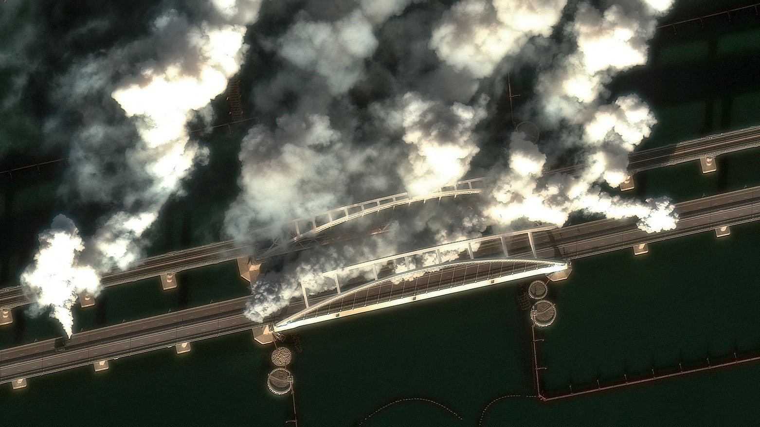 This satellite image, courtesy of 2026 Vantor, shows smoke generators on Crimea Bridge, also called Kerch Strait Bridge, which spans the Kerch Strait, in Kerch, Jun. 23, 2026 (AFP)