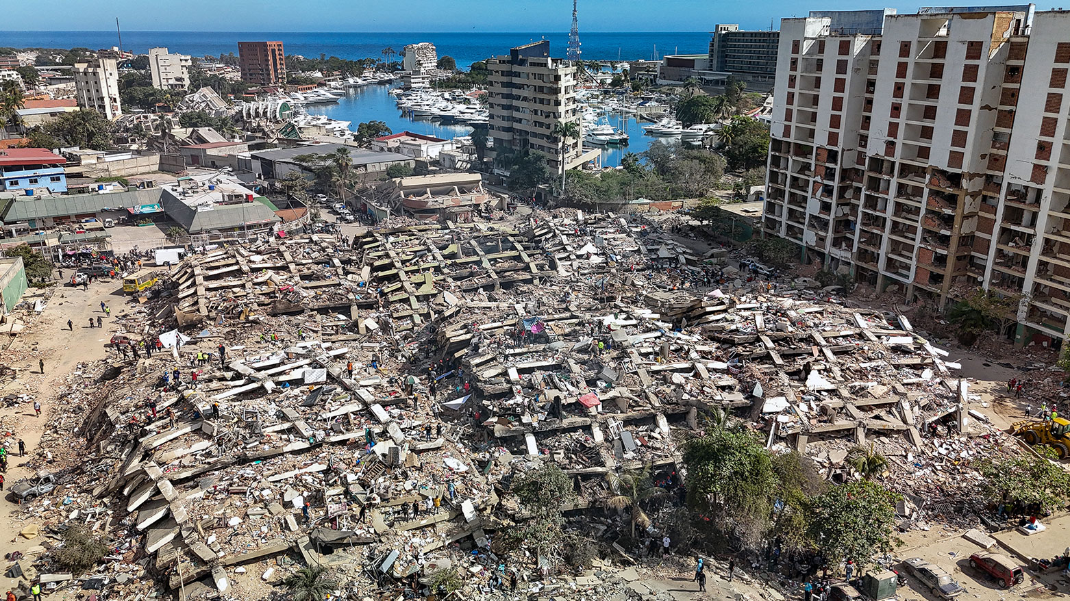 This aerial view shows destroyed buildings in Caraballeda, La Guaira state, Venezuela, on June 28, 2026, following earthquakes. (AFP)