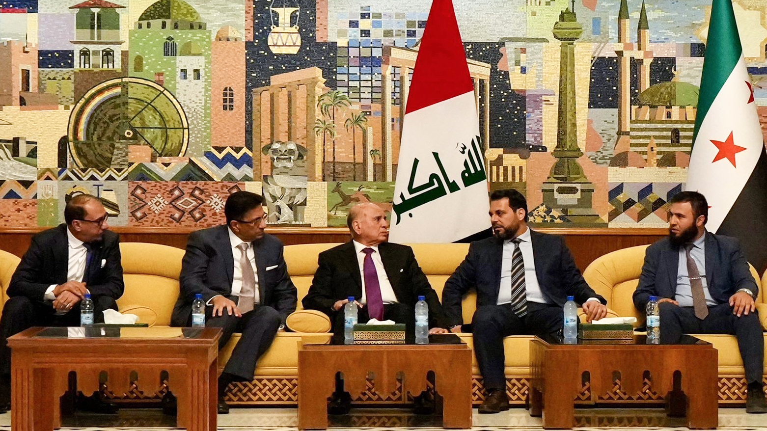 Iraqi FM Fuad Hussein (C) is welcomed by Syrian FM officials upon his arrival in Damascus for an official visit, June 29, 2026. (Photo: GOI)