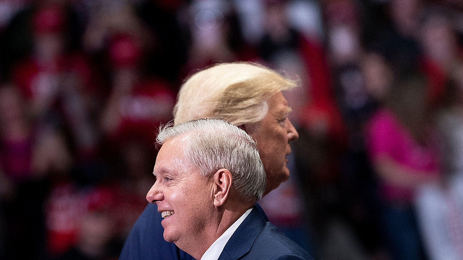 Late Sen. Lindsey Graham (R-SC) arrives to speak with US President Donald Trump (R) during a rally, Mar. 2, 2020, North Carolina. (AFP)