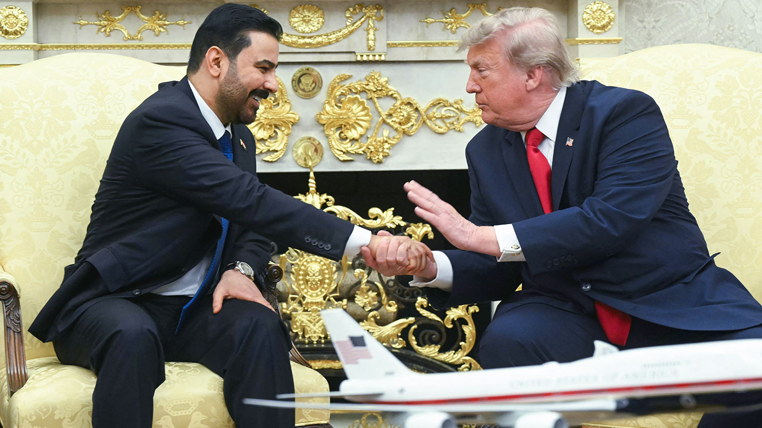 US President Donald Trump shakes hands with Prime Minister of Iraq Ali al-Zaidi (L) in the Oval Office of the White House in Washington, DC, on July 14, 2026. (AFP)