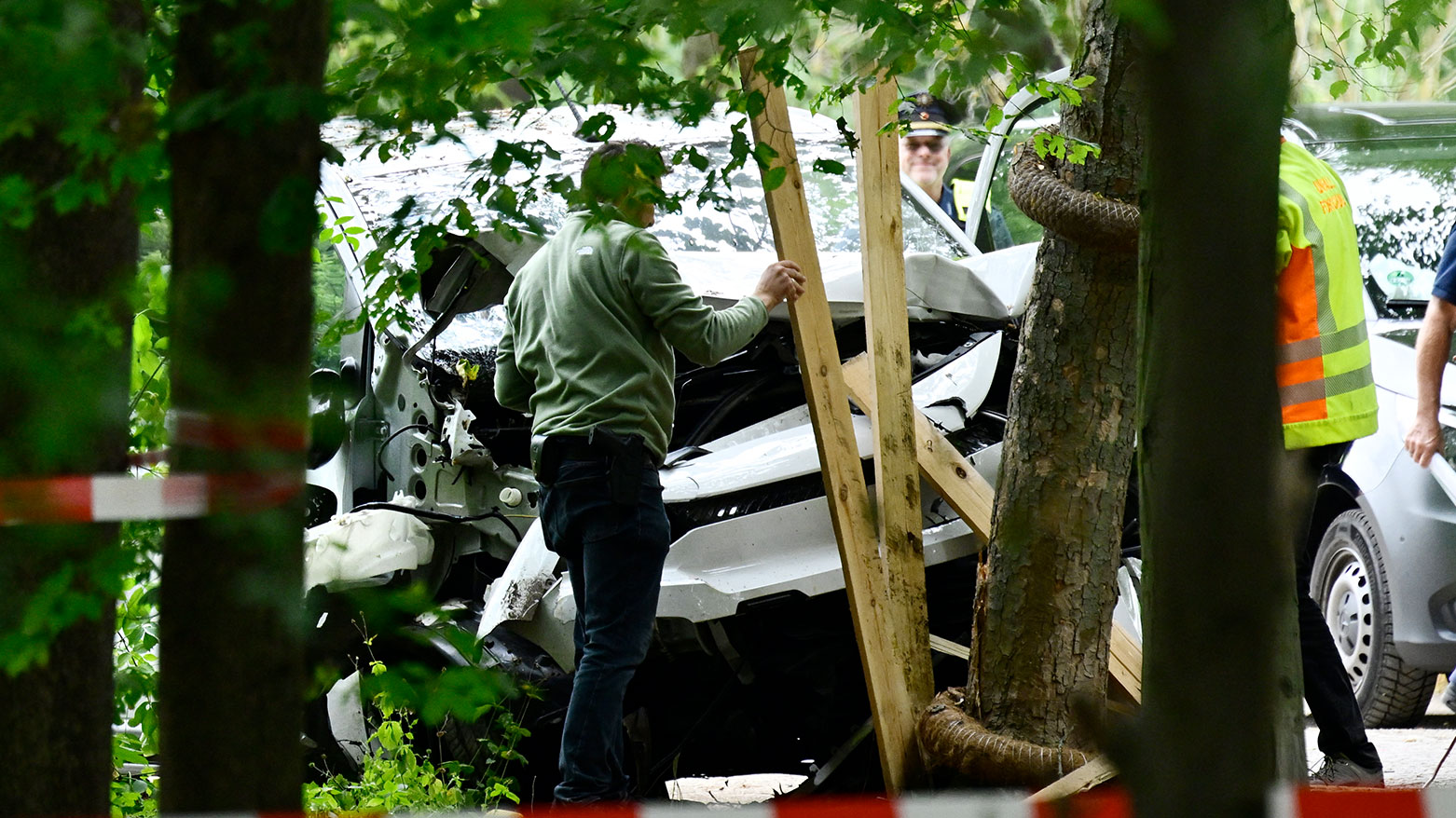 Police officers inspect on July 26, 2026 the car that alledgedly was driven into people. (AFP)