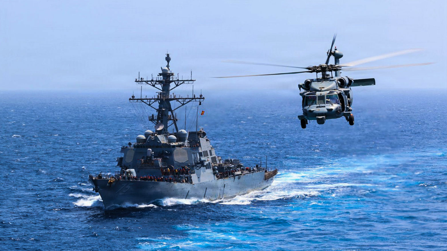 USS Donald Cook (DDG 75) transits the Arabian Sea while an MH-60S Sea Hawk flies nearby, July 18, 2026. (Photo: CENTCOM)