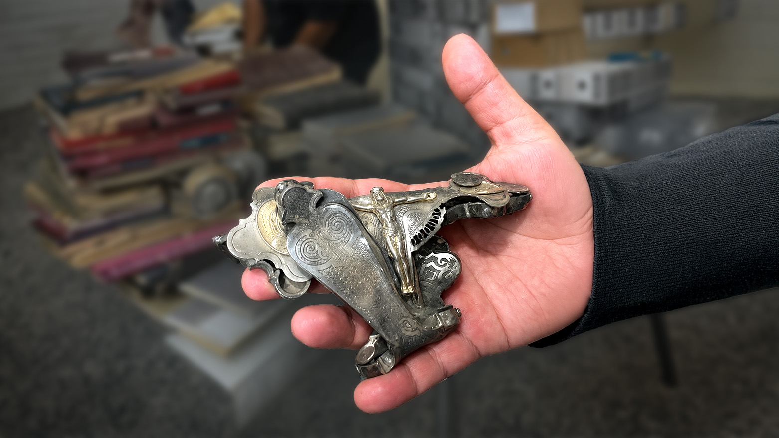Photo shows a piece of a cross that was damaged by ISIS in Bakhdida, Nineveh Plains. (Photo: Subimtted to Kurdistan24 by Ano Abdoka)