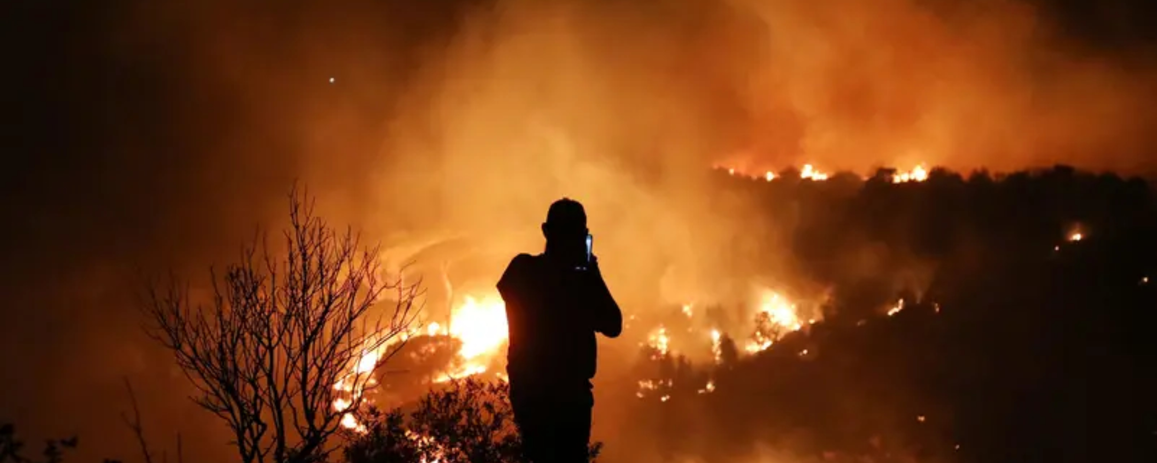 Hundreds of firefighters are battling strong winds to control the Europe wildfire (Photo: AFP)
