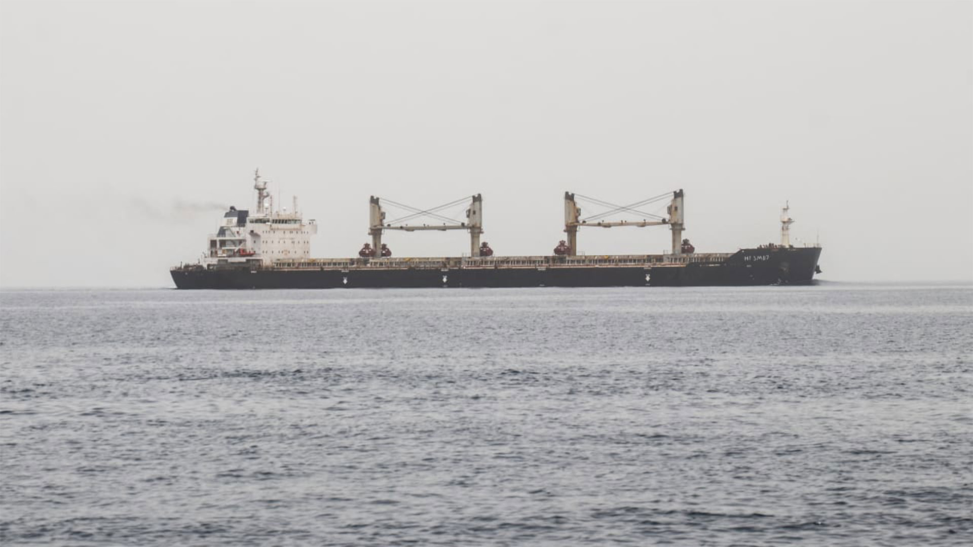 A commercial vessel passes through an international shipping lane off Yemen's Hanish Island in the Red Sea on July 27, 2026. (Photo: AFP)