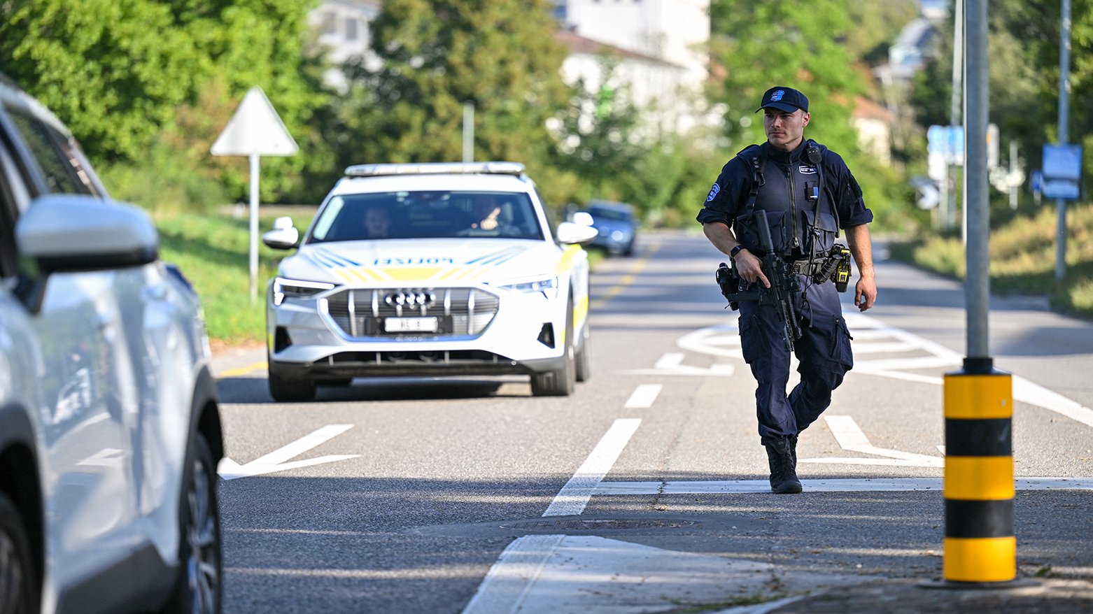 Police officers secure the area where a shooting occurred, in Aarau, northern Switzerland, on August 30, 2026. (AFP)