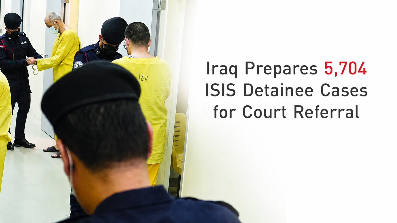 Iraqi guards supervise ISIS prisoners dressed in yellow uniforms. (Photo and Graphics: Kurdistan24)