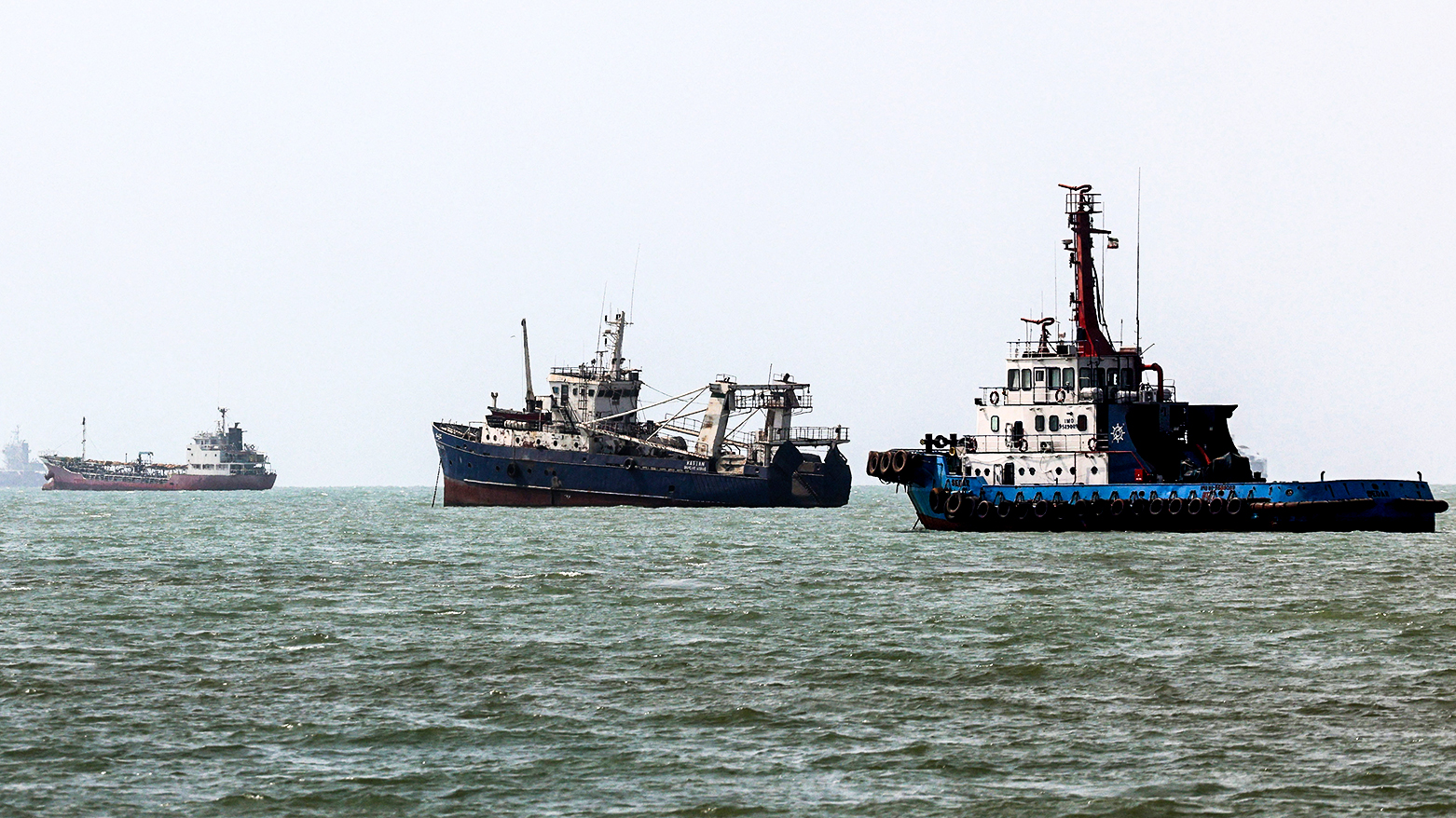 Vessels transit the Strait of Hormuz off Bandar Abbas in southern Iran on August 10, 2026. (AFP)