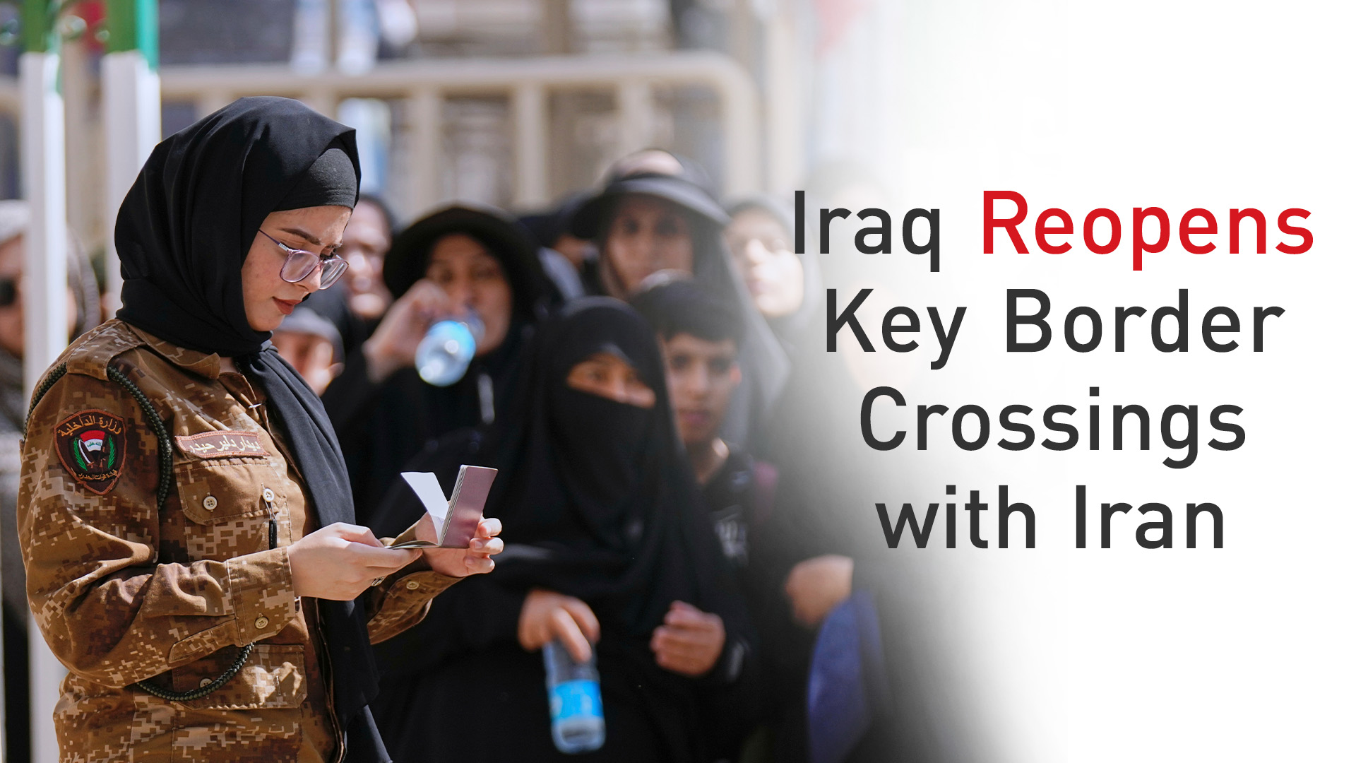 An Iraqi policewoman checks the passports of Iranian Shiite pilgrims at the Al-Mundheriya border crossing, Iraq, Friday, Aug. 8, 2025. (AP)
