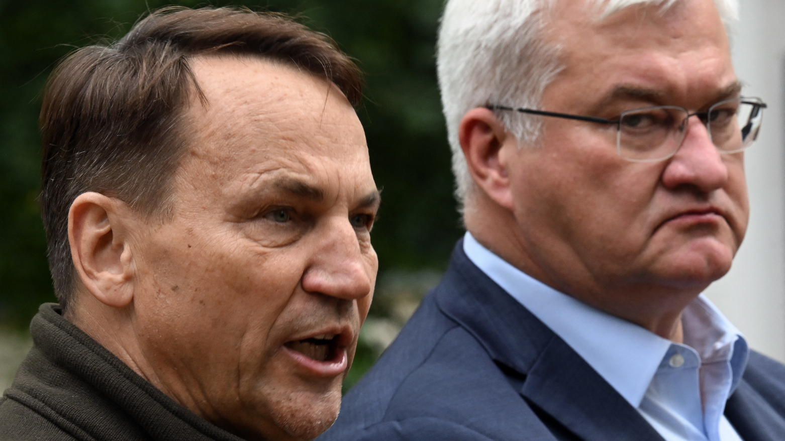 Poland's FM Radoslaw Sikorski (L) addresses the media next to Ukraine's FM Andriy Sybiga (R) as they take part in a joint briefing in Kyiv on Sept. 13, 2026. (AFP)