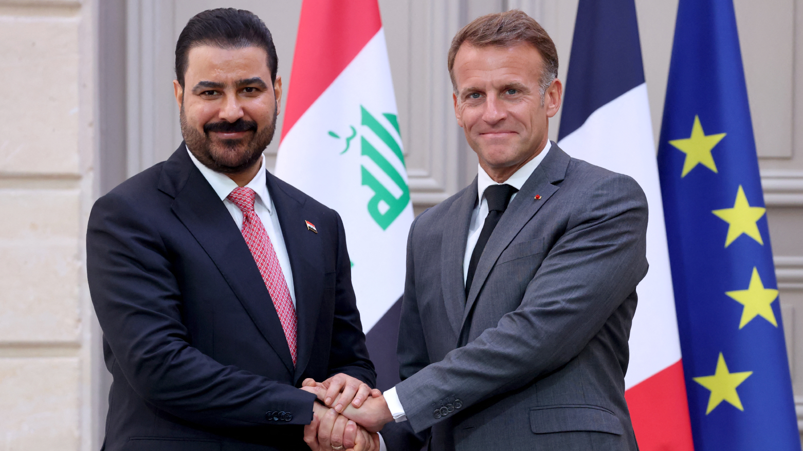 France's President Emmanuel Macron (R) shakes hand with Iraq's Prime Minister Ali al-Zaidi (L), at the Elysee Palace in Paris on Sep. 14, 2026. (AFP)