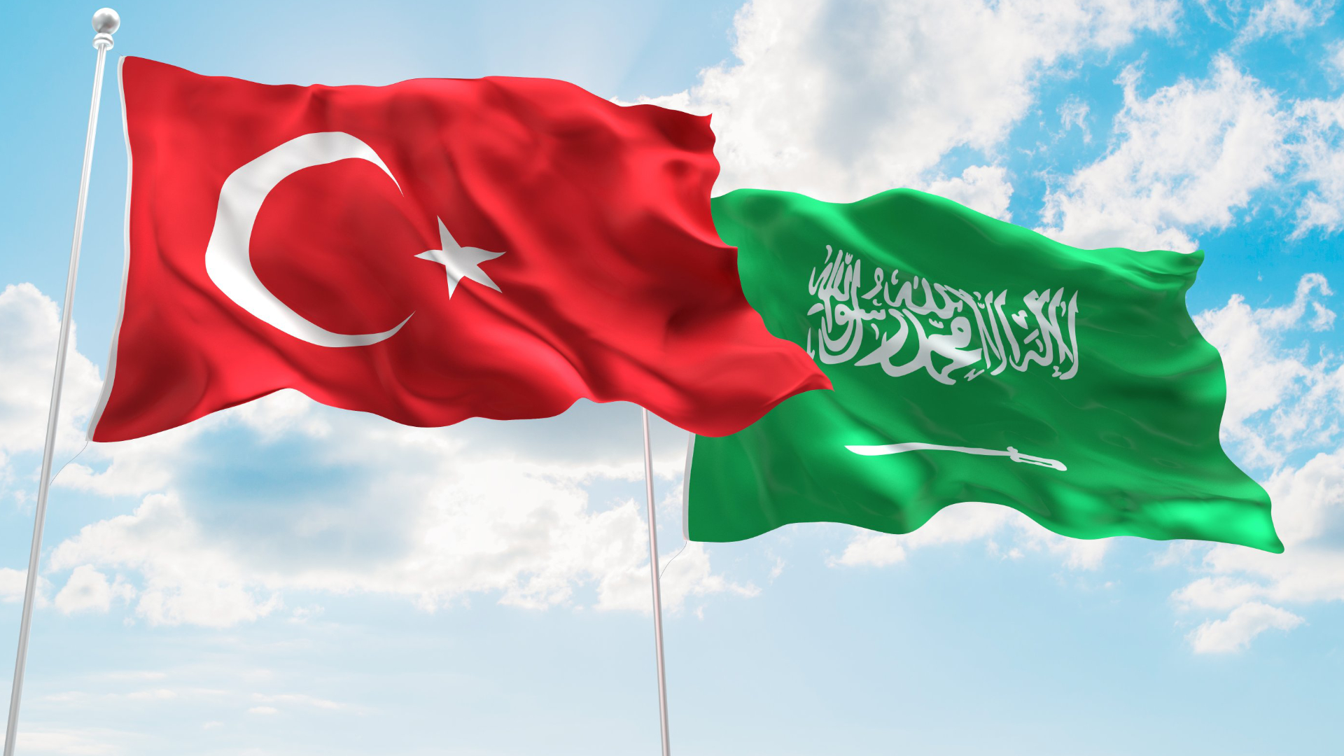 Turkish (left) and Saudi Arabian flags waving in the sky. (Photo: Shutterstock)