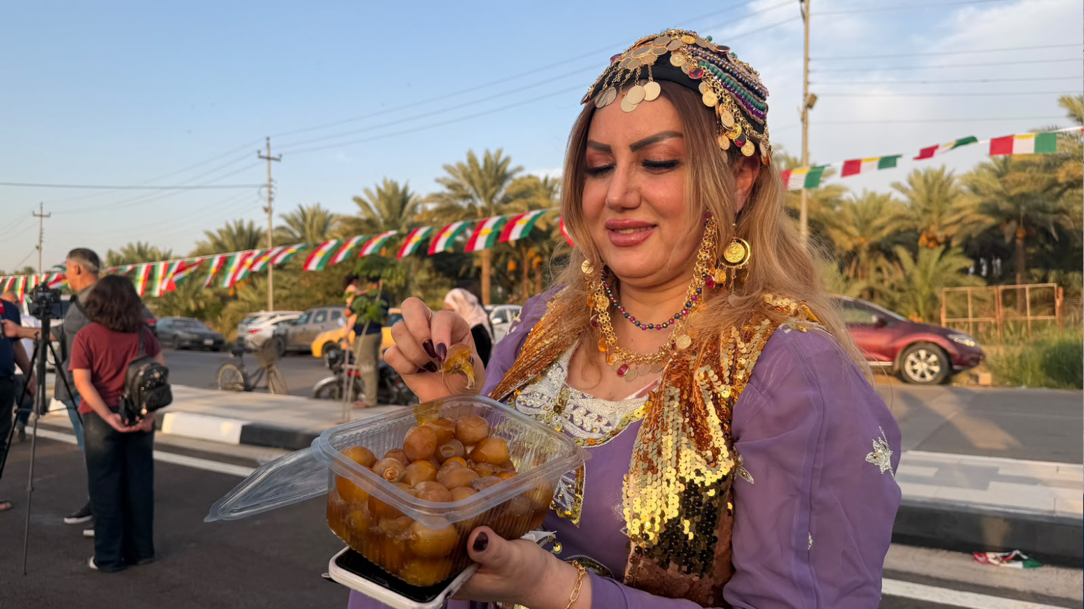 Berivan, a Khanaqin resident dressed in traditional Kurdish clothing at the Khanaqin's Date Festival. (Photo: Kurdistan24)