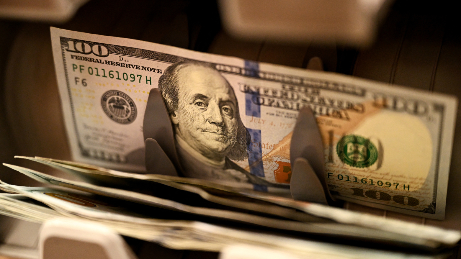 Photo shows a 100 USD bill. (AFP)