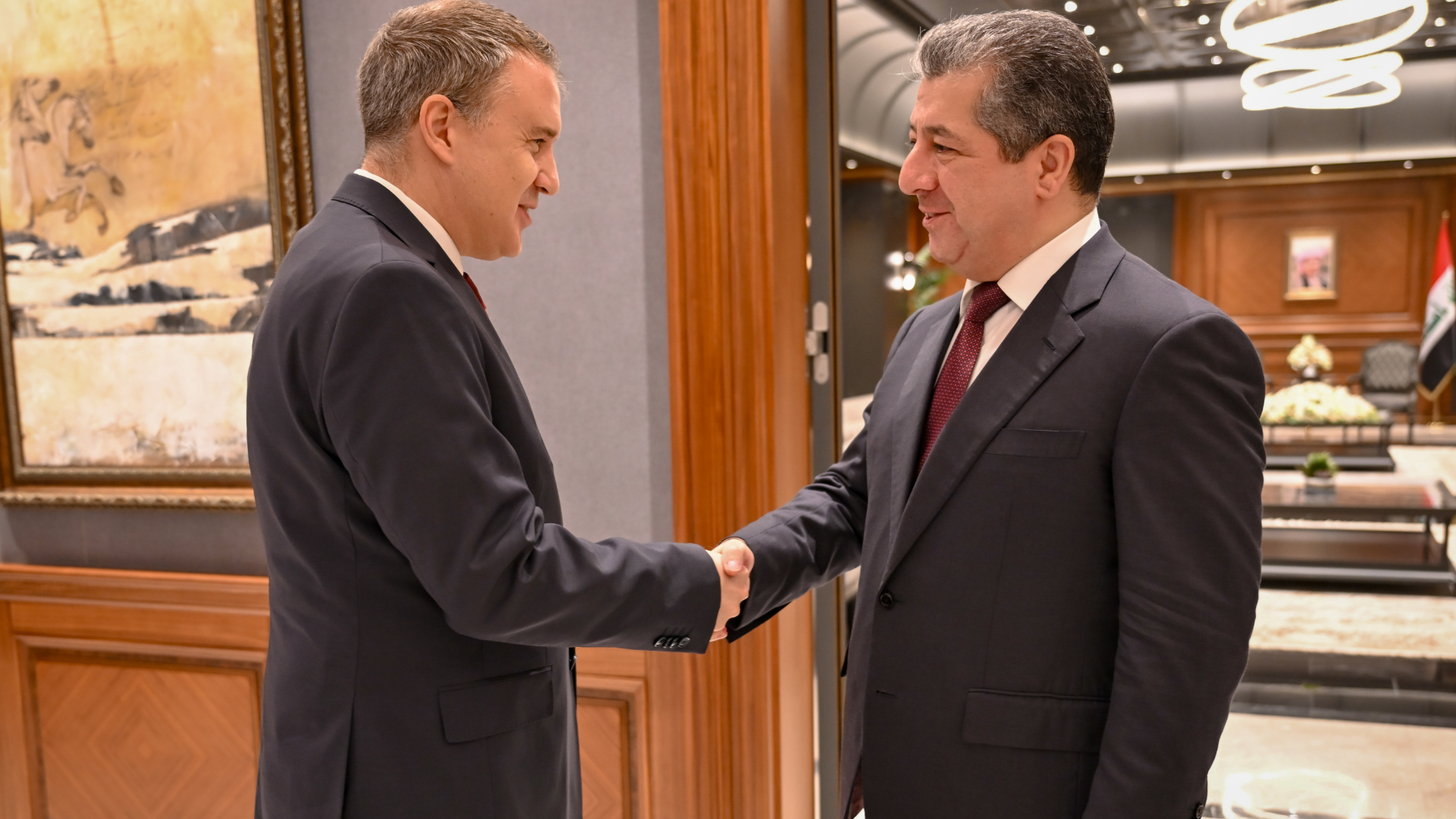 Prime Minister Masrour Barzani (R) shakes hands with Turkish Ambassador to Iraq Anil Bora Inan (L). (Photo: KRG)