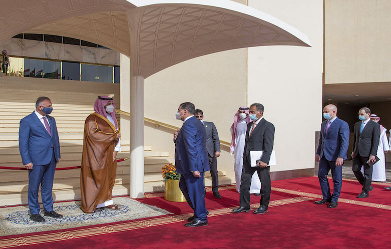 Saudi Crown Prince Mohammed bin Salman (2nd left) flanked by Iraqi Prime Minister Mustafa al-Kadhemi (left) as he greets the Iraqi delegation in Riyadh on March 31, 2021. (Photo: AFP / Saudi Royal Palace / Bandar Al-Jaloud)