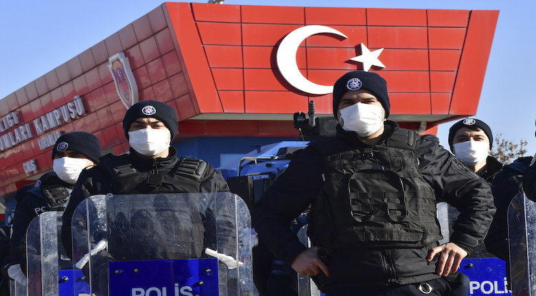 Riot police officers stand at the entrance of a courthouse in Ankara, Turkey during the trial of 475 defendants, including generals and fighter jet pilots accused in the 2016 failed coup attempt, Nov. 26, 2020. (Photo: AP)