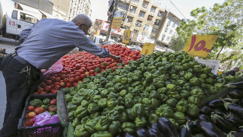 An Iraqi man buys fresh produce at a shop in the Iraqi capital Baghdad, on April 11, 2021 ahead of Muslim holy fasting month of Ramadan. (Photo: Sabah Arar / AFP)