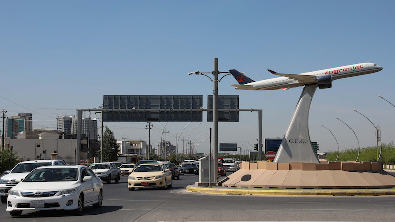 A model Kurdish carrier “Zagrosjet” airplane decorates the center of a roundabout near Erbil’s International airport on April 15, 2021. (Photo: Safin Hamed / AFP)