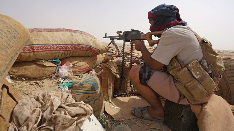 A fighter with forces loyal to Yemen’s Saudi-backed government holds a position against Houthi rebels in Yemen’s northeastern province of Marib, April 16, 2021. (Photo: AFP)