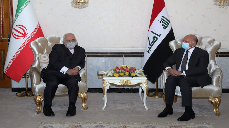 Iraqi Foreign Minister Fouad Hussein, right, meets with visiting Iranian counterpart Mohammad Javad Zarif in Baghdad, Iraq, April 26, 2021. (Photo: Khalid Mohammed/AP)