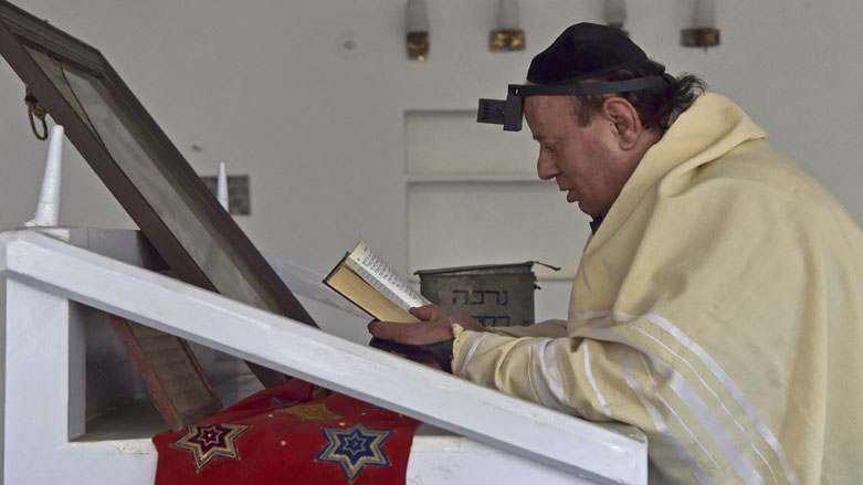 Afghan Jew Zebulon Simentov recites the Torah scripture at synagogue, housed in an old building in Kabul, April 5, 2021. (Photo: Wakil Kohsar / AFP)