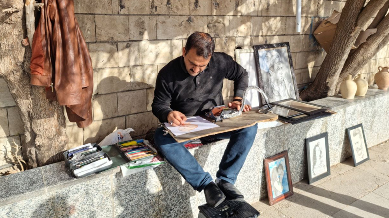 Shukri Abd Attiye, 39, from Anbar works in the Erbil Citadel as a portrait drawer (Photo: Wladimir van Wilgenburg/Kurdistan 24).