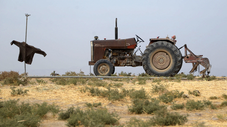 A tractor ploughs a parcel of agricultural land, on the outskirts of the town of Tel Keppe (Tel Kaif) north of the city of Mosul in the northern Iraqi province of Nineveh, Oct. 26, 2021. (Photo: Zaid Al-Obeidi/AFP)