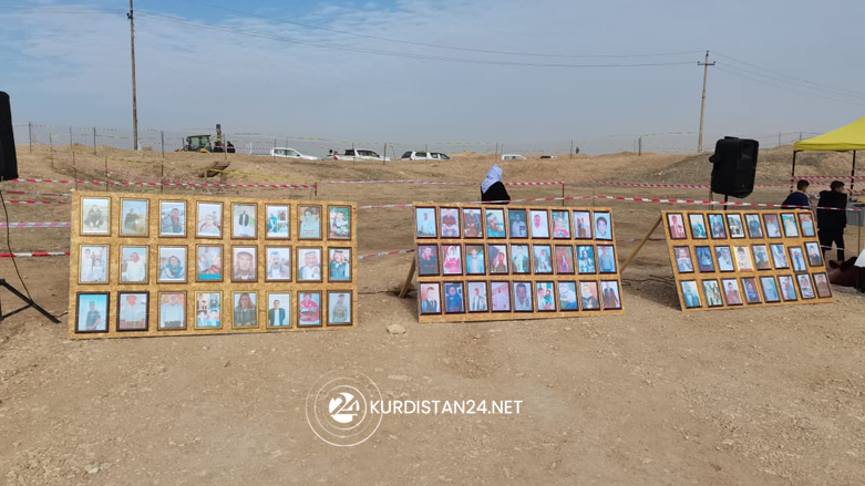 Photos of missing Yezidis displayed near a mass grave in Sinjar's Hardan village, Feb. 22, 2022. (Photo: Darman Ba'adri/Kurdistan 24)