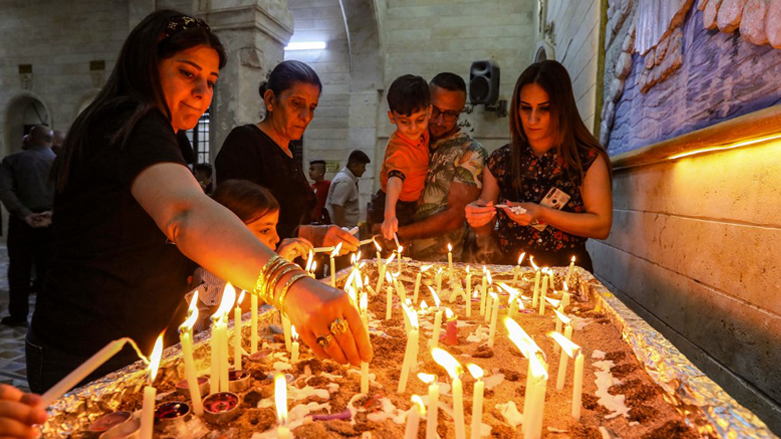 Iraqi Orthodox Christians celebrating Easter Saturday light candles, at the church of the ancient Mar Matta monastery of Saint Matthew in the village of Bashiqa, April 23, 2022. (Photo: Safin Hamed/AFP)