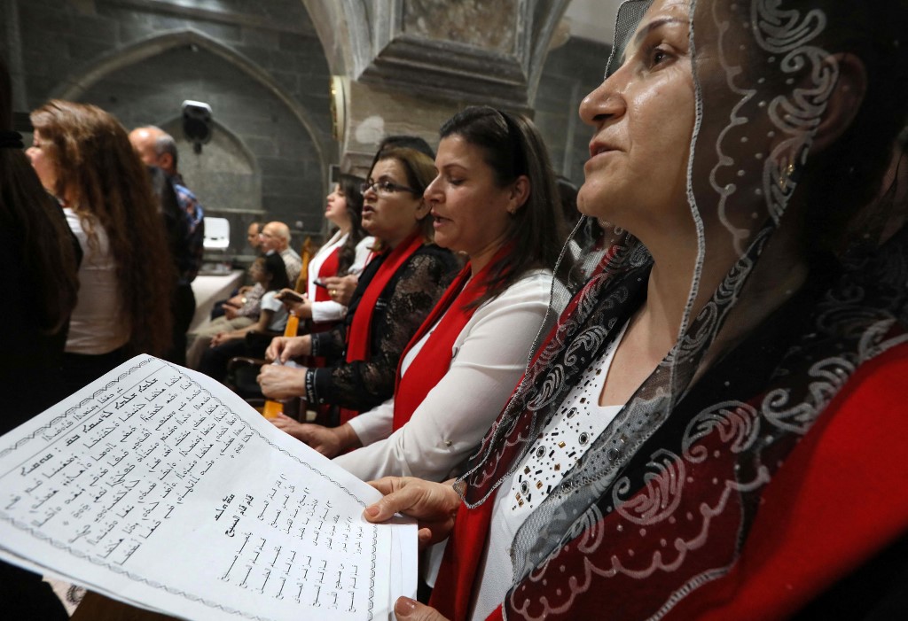 Iraqi Orthodox Christians celebrate Easter Saturday at the church of the ancient Mar Matta monastery of Saint Matthew in the village of Bashiqa, April 23, 2022. (Photo: Safin Hamed/AFP)