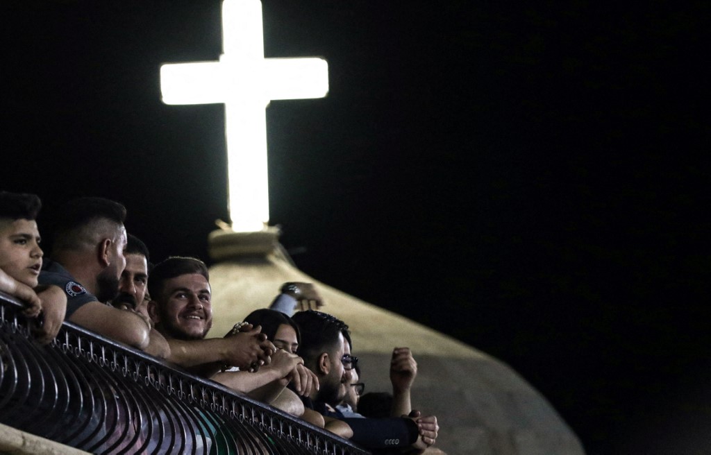 Iraqi Orthodox Christians celebrate Easter Saturday at the church of the ancient Mar Matta monastery of Saint Matthew in the village of Bashiqa, April 23, 2022. (Photo: Safin Hamed/AFP)
